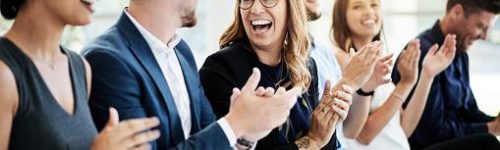 Shot of a group of businesspeople applauding during a seminar Shot of a group of businesspeople applauding during a seminar